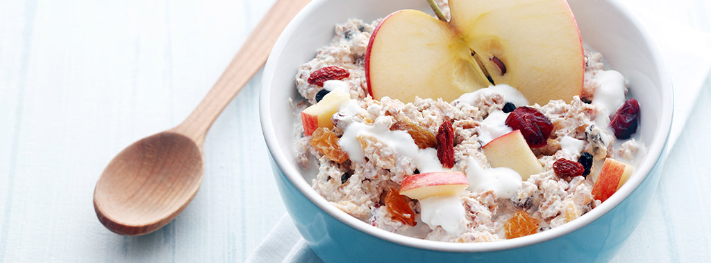 Header image bowl of muesli with a wooden spoon beside and the importance of breakfast heading